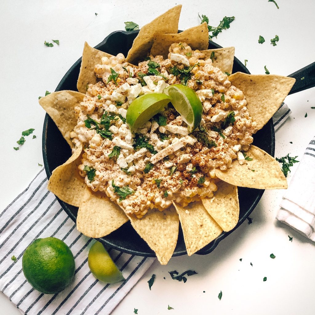 If you're a lover of nachos, I may have your new favorite dish! Mexican Street Corn Nachos, a delicious and different BBQ side dish! Check it out on my blog
